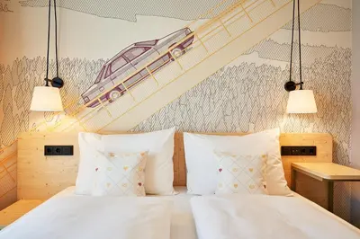 Ein Bett oder Betten in einem Zimmer der Unterkunft McDreams Hotel Ingolstadt
