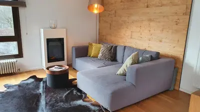 Ein Sitzbereich in der Unterkunft Bungalow mit Terrasse im alpinen Stil