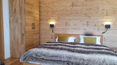 Ein Bett oder Betten in einem Zimmer der Unterkunft Bungalow mit Terrasse im alpinen Stil