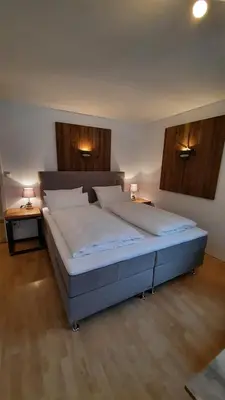 Ein Bett oder Betten in einem Zimmer der Unterkunft Isartaler Hoamat Haus