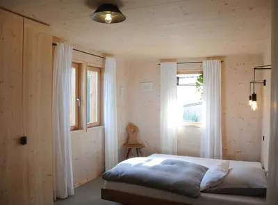 Ein Bett oder Betten in einem Zimmer der Unterkunft Architektenhaus Reischl mit Sauna