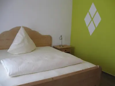 Ein Bett oder Betten in einem Zimmer der Unterkunft Wirtsberg Pension & Cafe