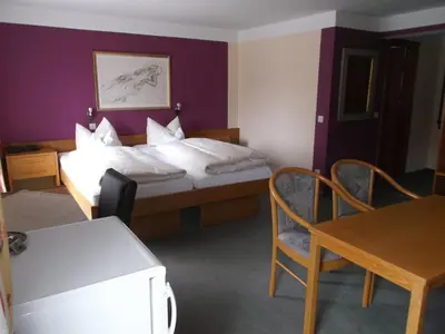 Ein Bett oder Betten in einem Zimmer der Unterkunft Hotel Bavaria