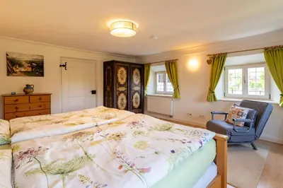 Ein Bett oder Betten in einem Zimmer der Unterkunft Huberhof Meisham