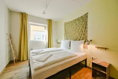 Ein Bett oder Betten in einem Zimmer der Unterkunft Wombat's City Hostel Munich Werksviertel