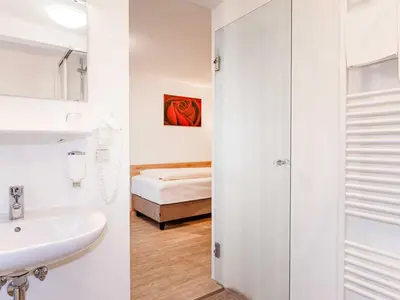 Ein Bett oder Betten in einem Zimmer der Unterkunft Gasthof Neuwirt