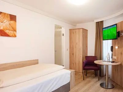Ein Bett oder Betten in einem Zimmer der Unterkunft Gasthof Neuwirt