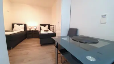 Ein Bett oder Betten in einem Zimmer der Unterkunft Neuburg Downtown Apartements