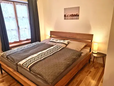 Ein Bett oder Betten in einem Zimmer der Unterkunft Ferienwohnung Berglust