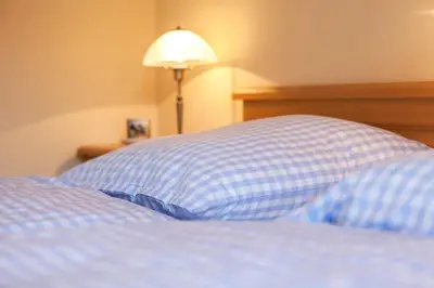 Ein Bett oder Betten in einem Zimmer der Unterkunft Ferienhaus Balsbergblick