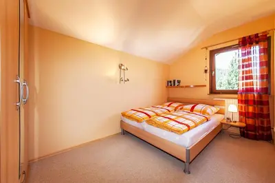 Ein Bett oder Betten in einem Zimmer der Unterkunft Ferienhaus Balsbergblick