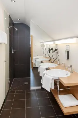 Ein Badezimmer in der Unterkunft Hotel Aiterbach am Chiemsee