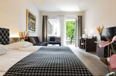 Ein Bett oder Betten in einem Zimmer der Unterkunft Dom Hotel
