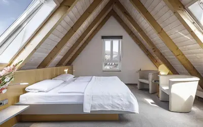 Ein Bett oder Betten in einem Zimmer der Unterkunft Dom Hotel