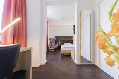 Ein Bett oder Betten in einem Zimmer der Unterkunft Dom Hotel