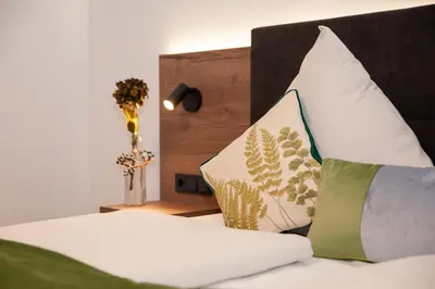 Ein Bett oder Betten in einem Zimmer der Unterkunft Gasthaus Stöttnerbräu