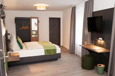 Ein Bett oder Betten in einem Zimmer der Unterkunft Gasthaus Stöttnerbräu