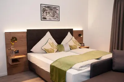 Ein Bett oder Betten in einem Zimmer der Unterkunft Gasthaus Stöttnerbräu