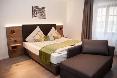 Ein Bett oder Betten in einem Zimmer der Unterkunft Gasthaus Stöttnerbräu