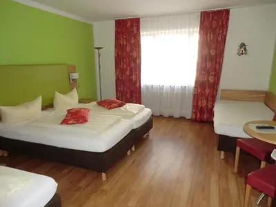 Ein Bett oder Betten in einem Zimmer der Unterkunft Hotel Pension Haydn