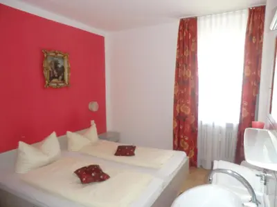Ein Bett oder Betten in einem Zimmer der Unterkunft Hotel Pension Haydn