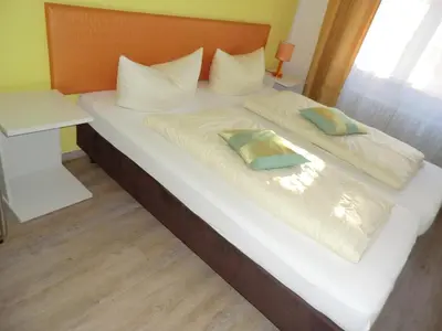 Ein Bett oder Betten in einem Zimmer der Unterkunft Hotel Pension Haydn