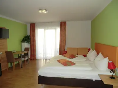 Ein Bett oder Betten in einem Zimmer der Unterkunft Hotel Pension Haydn