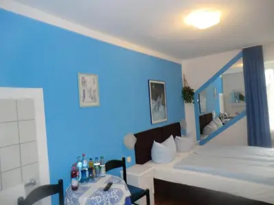 Ein Bett oder Betten in einem Zimmer der Unterkunft Hotel Pension Haydn