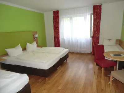 Ein Bett oder Betten in einem Zimmer der Unterkunft Hotel Pension Haydn