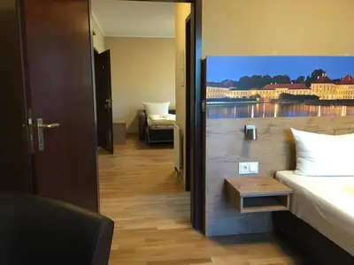 Ein Bett oder Betten in einem Zimmer der Unterkunft Parkhotel Leiser