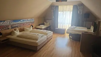 Ein Bett oder Betten in einem Zimmer der Unterkunft Parkhotel Leiser