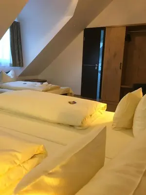 Ein Bett oder Betten in einem Zimmer der Unterkunft Parkhotel Leiser