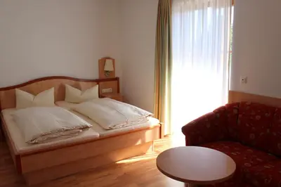 Ein Bett oder Betten in einem Zimmer der Unterkunft Hotel-Gasthof Kramerwirt
