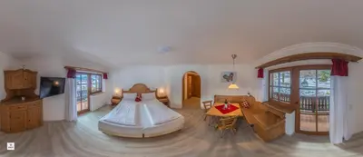 Ein Bett oder Betten in einem Zimmer der Unterkunft Landhotel Lärchenhügel