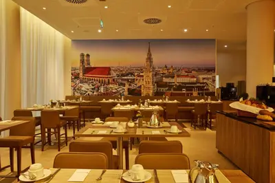 Ein Restaurant oder anderes Speiselokal in der Unterkunft H4 Hotel München Messe