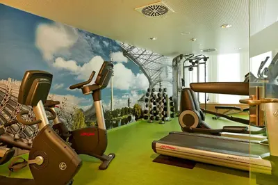 Das Fitnesscenter und/oder die Fitnesseinrichtungen in der Unterkunft H4 Hotel München Messe