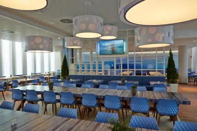 Ein Restaurant oder anderes Speiselokal in der Unterkunft H2 Hotel München Messe