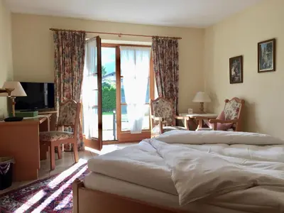 Ein Bett oder Betten in einem Zimmer der Unterkunft DEVA Achentaler Vitalhotel