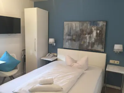 Ein Bett oder Betten in einem Zimmer der Unterkunft Arthotel Restaurant Pfeffermühle