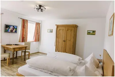 Ein Bett oder Betten in einem Zimmer der Unterkunft Gästehaus Niedermeierhof
