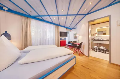 Ein Bett oder Betten in einem Zimmer der Unterkunft Kneipp- und Wellvitalhotel Edelweiss