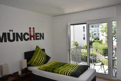Ein Bett oder Betten in einem Zimmer der Unterkunft Boardinghouse Henschelstraße