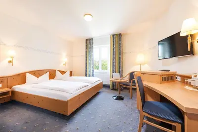 Ein Bett oder Betten in einem Zimmer der Unterkunft Hotel Landgasthof Hofmeier