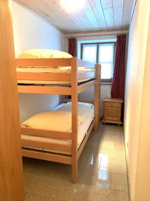 Ein Bett oder Betten in einem Zimmer der Unterkunft Almpartments Rosengasse