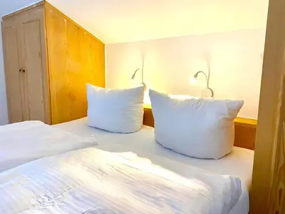 Ein Bett oder Betten in einem Zimmer der Unterkunft Gemütliche Ferienwohnung am Tegernsee - ruhig im Dachgeschoss