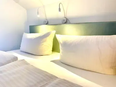 Ein Bett oder Betten in einem Zimmer der Unterkunft Gemütliche Ferienwohnung am Tegernsee - ruhig im Dachgeschoss