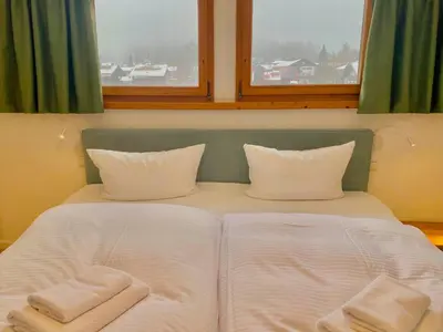 Ein Bett oder Betten in einem Zimmer der Unterkunft Feine FeWo im DG am Tegernsee