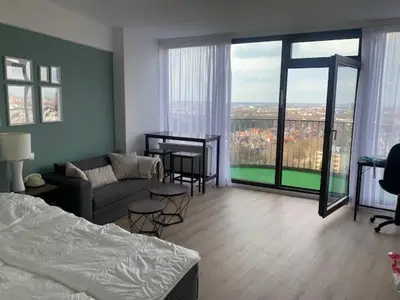 Ein Bett oder Betten in einem Zimmer der Unterkunft Sky Apartment im Hotelturm