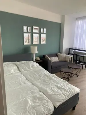 Ein Bett oder Betten in einem Zimmer der Unterkunft Sky Apartment im Hotelturm