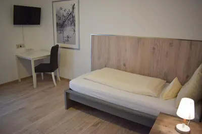 Ein Bett oder Betten in einem Zimmer der Unterkunft Abendruhe Hotel - kontaktloser Check In